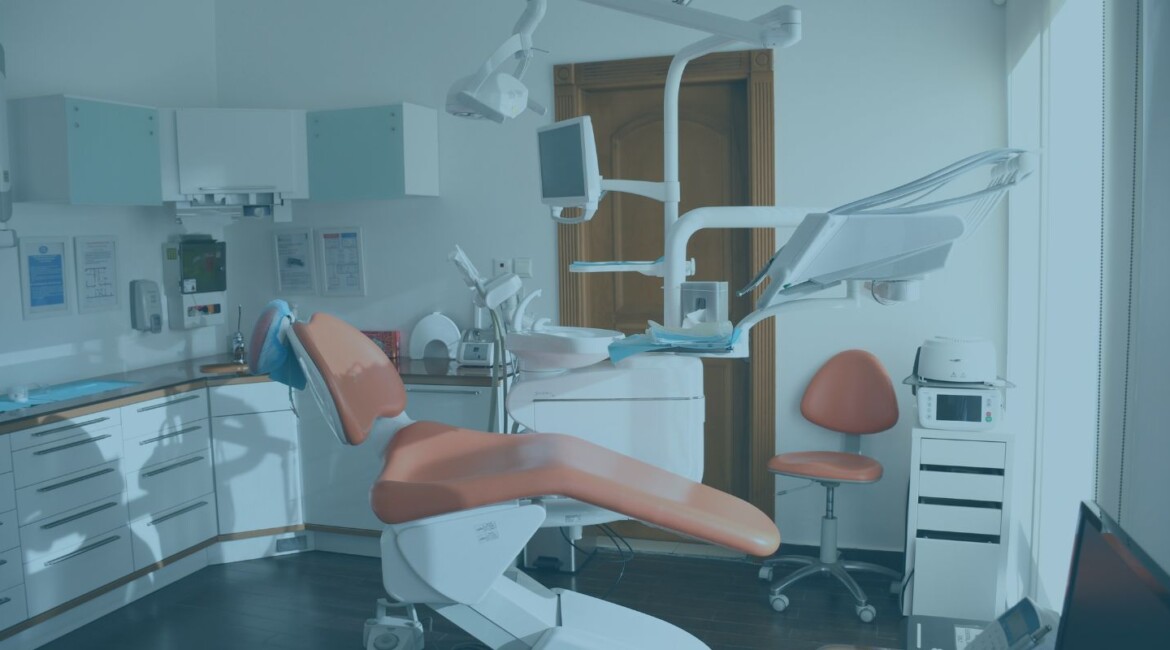 Dental practice owner and buyer reviewing sale documents Buying or selling a dental practice with CQC, property and goodwill issues Dental practice acquisition legal advice in England and Wales