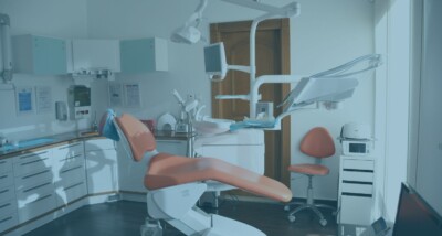 Dental practice owner and buyer reviewing sale documents Buying or selling a dental practice with CQC, property and goodwill issues Dental practice acquisition legal advice in England and Wales