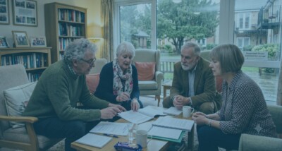 Leaseholders reviewing Right to Manage documents for their building RTM company directors discussing service charges and building management Right to Manage process for leaseholders taking control of a residential building