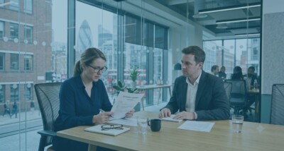 Employee reviewing a redundancy settlement agreement before signing At risk of redundancy and checking settlement agreement terms Legal advice on redundancy settlement agreement for employees