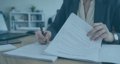 Business seller reviewing an earn-out dispute after completion Earn-out agreement dispute involving buyer conduct after business sale Former business owner reviewing post-completion performance and deferred consideration