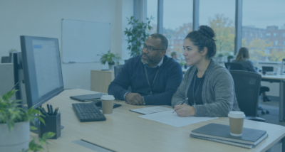 HR manager and IT colleague reviewing email records and a checklist to prepare responses to subject access requests.