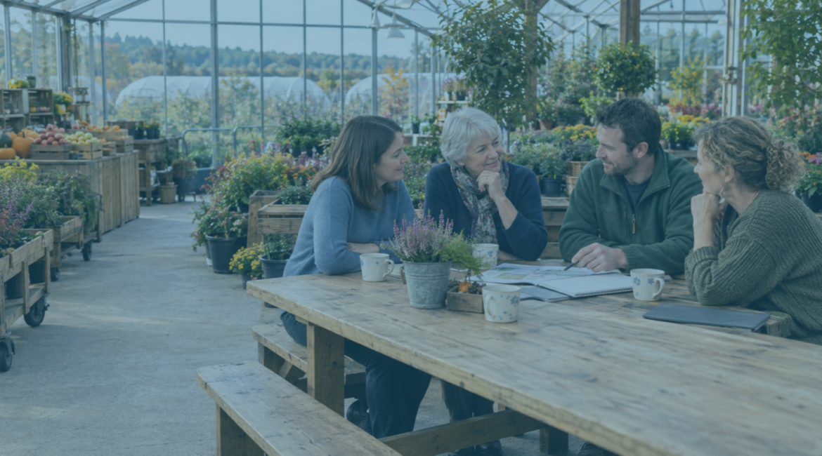 A mother and her three adult children discussing a family business demerger around a pine table in their Worcestershire garden centers' glasshouse cafe.